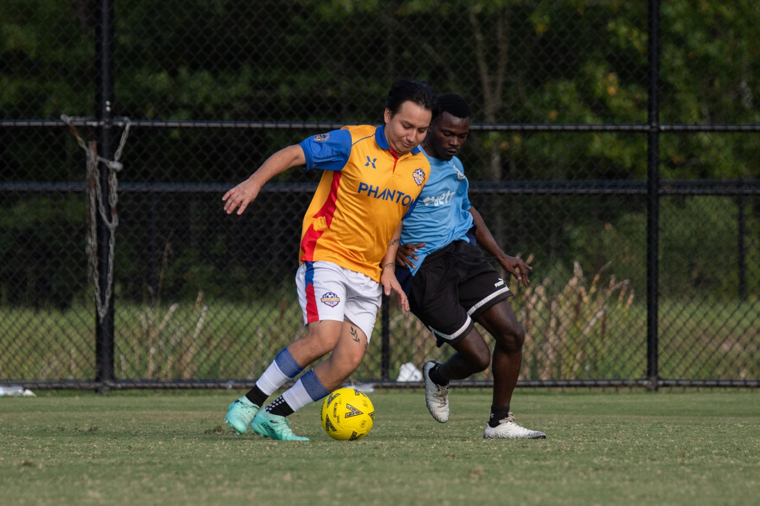 Phantom FC player shielding the ball from an opponent