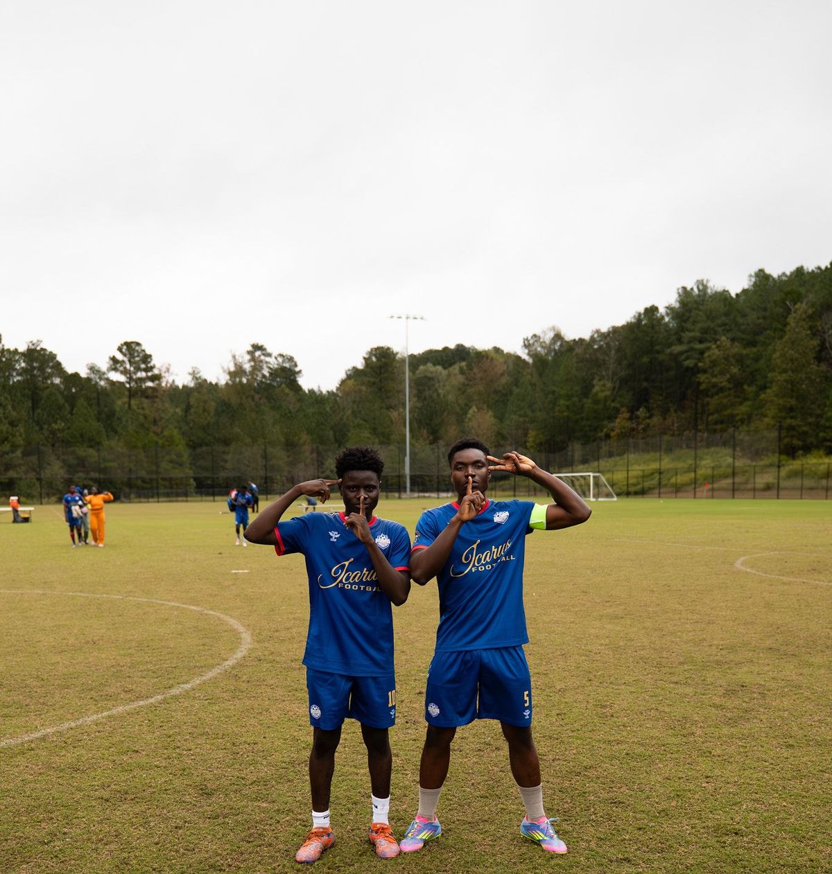Two Phantom FC players celebrating together