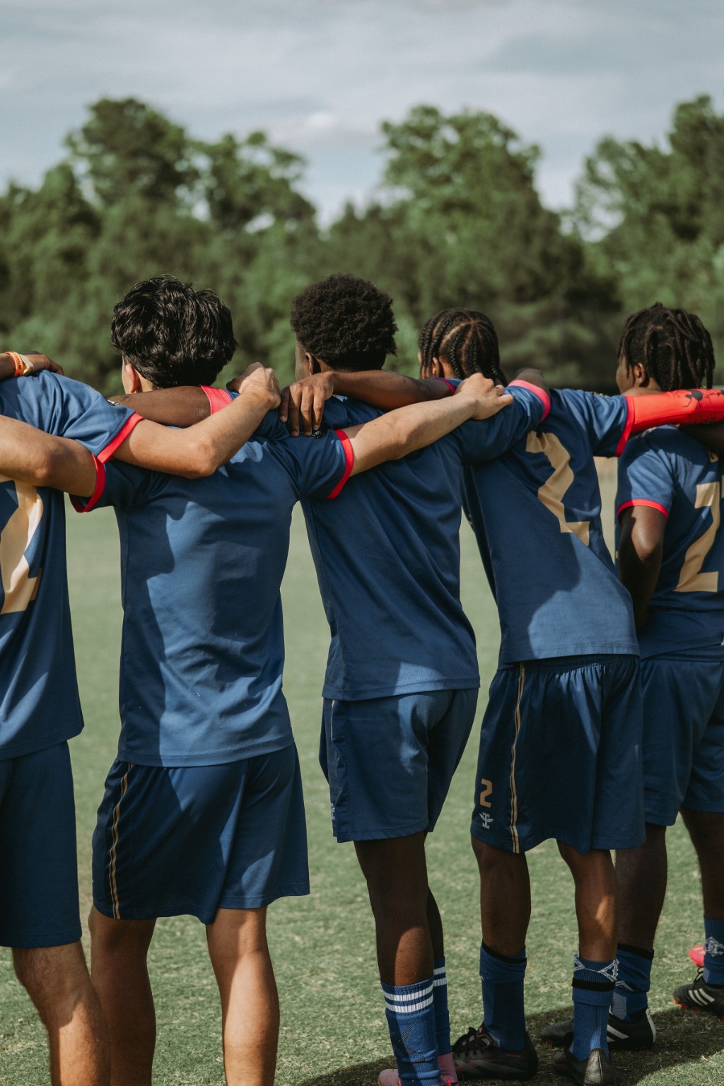 Phantom FC players linked together in a pre-match huddle