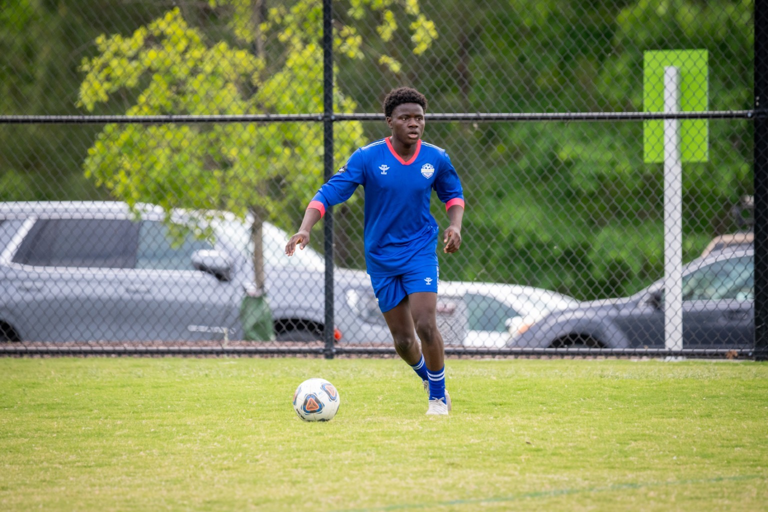 Phantom FC player building an attack from midfield